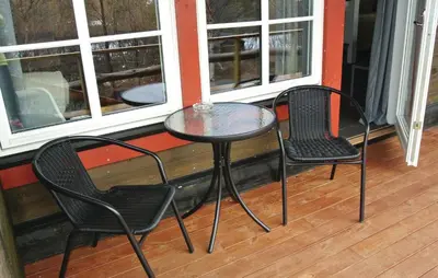 two chairs and a table on a porch at Amazing Home In Hemsedal With Sauna in Hemsedal
