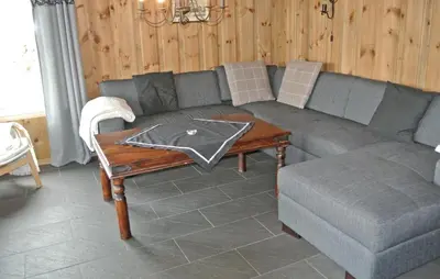 a living room with a couch and a table at Amazing Home In Hemsedal With Sauna in Hemsedal