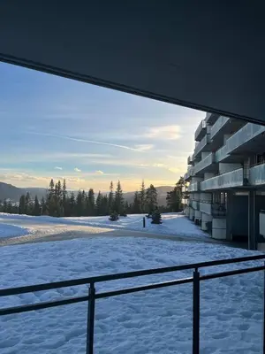 a view from the balcony of a building in the snow at Kvitfjell mountain in Strande