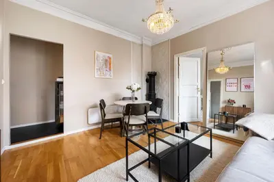 a living room with a table and a couch at Bright City Apartment - Perfect Central Stay in Bergen