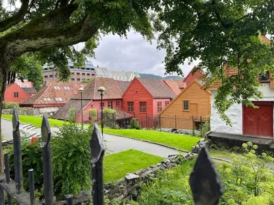 a view of a village with red and yellow houses at Bergenshus rett ved Bryggen i Bergen in Bergen