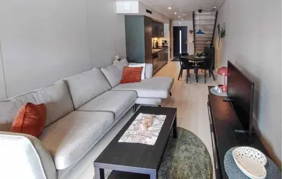 a living room with a couch and a table at Amazing Apartment In Bjorli in Bjorli