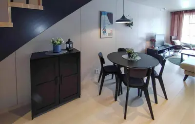 a living room with a table and a dining room at Amazing Apartment In Bjorli in Bjorli
