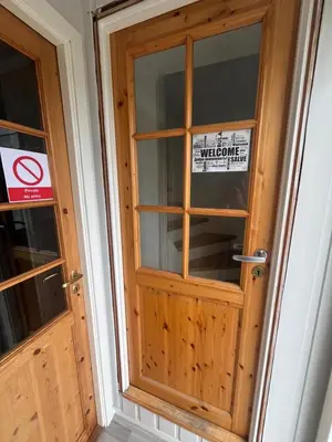 a wooden door with a sign on it at Loft apartment with 3 bedrooms in Trondheim
