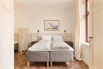 a bedroom with a bed in a room with a window at F7 l Architects Choice in Bergen