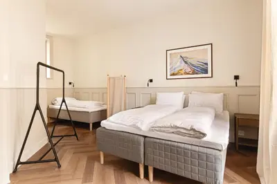 a bedroom with two beds in a room at F7 l Architects Choice in Bergen