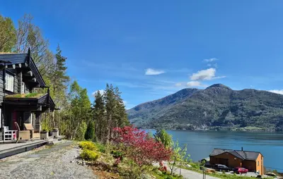 a house with a view of a lake and mountains at 4 Bedroom Stunning Home In Tørvikbygd in Tyrvikbygd