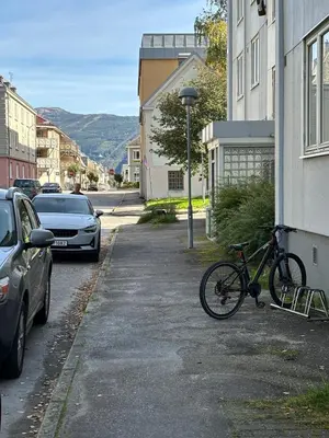 a bike parked on the side of a building at Leilighet Rjukan sentrum in Rjukan