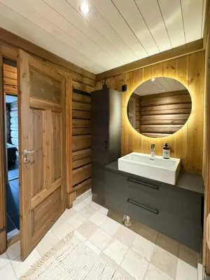 a bathroom with a sink and a mirror at Timber Cabin With Views Over Golsfjellet in Gol