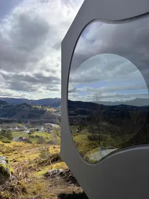 a circular window on the side of a building at Birdbox Bergen in Bergen