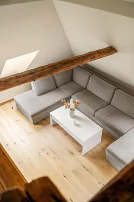 a living room with a couch and a table at DINBNB Apartments l 200m to Bryggen l Luxury 2 BR l 2min to Floibanen in Bergen