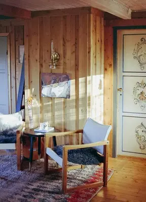 a room with a table and a chair and a door at Cozy Cabin In Scenic Vøringsfoss in Garden