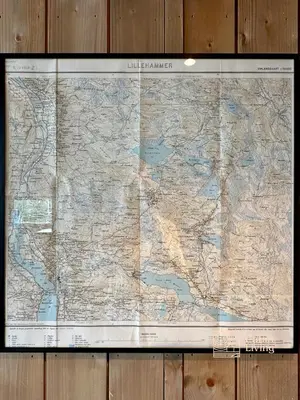 a large map hanging on a wooden wall at Modern mountain cabin Ski in-out 2 Bathrooms in Ringsaker
