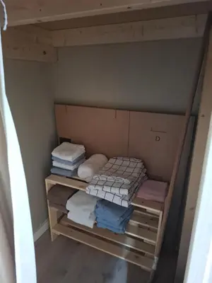 a room with a bunk bed with folded towels at Apartment in the heart of Sunnmore in Vigra