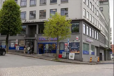 a building on the corner of a street at Rålekker 2-roms leilighet in Bergen