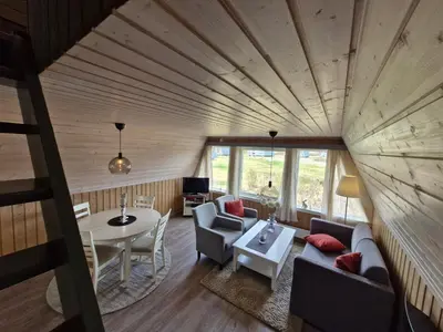 an overhead view of a living room with a table at Fjellhytte i Valdres, rett ved nasjonalpark og turstier in Robøle