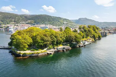 an aerial view of a river with houses and trees at Welcome to our home in the centre of Bergen! in Bergen