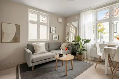 a living room with a couch and a table at Welcome to our home in the centre of Bergen! in Bergen