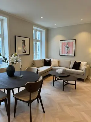 a living room with a couch and a table at MB25 Apartment in Bergen