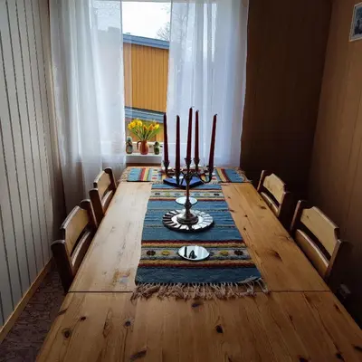 a dining room table with candles on top of it at Leilighet nær E4 i sentrum av Eina in Eina
