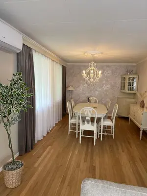 a dining room with a table and chairs at Magnhilds Luxury Apartment in Otta