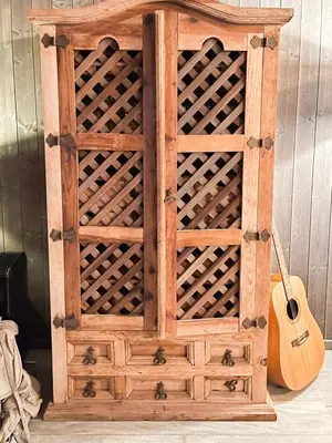 a wooden cabinet with a guitar and a guitar at Mountain Escape Near Gulsrud With Historical Charm in Eggedal