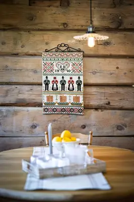 a table with a plate of food on top at Tømmerhuset på Brekketunet in Stryn