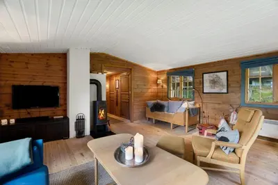 a living room with a couch and a table at Mountain Cabin With Cross-Country Trails In Rauland in Rauland