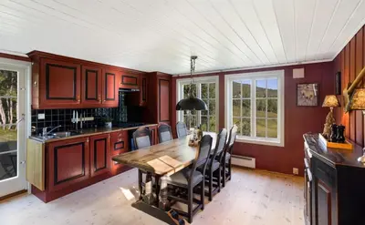 a kitchen with a wooden table and chairs at Mountain Cabin With Cross-Country Trails In Rauland in Rauland