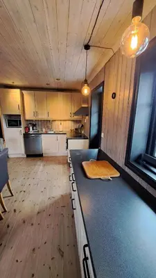 a kitchen with a counter top in a room at Cozy Cottage in Rauland Vierli in Torvetjørn