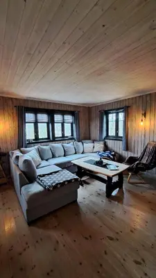 a living room with a couch and a coffee table at Cozy Cottage in Rauland Vierli in Torvetjørn
