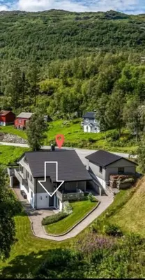 an aerial view of a house on a hill at Leilighet i Røldal in Håra