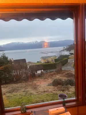 a window with a view of a body of water at 4 bedroom room House in Beautiful Strandebarm in Kvam