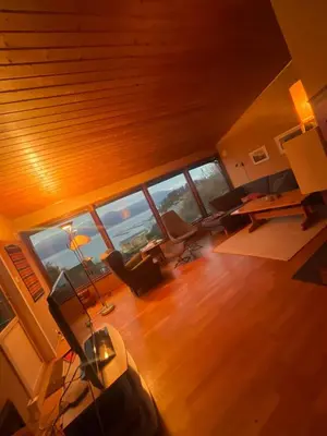 an overhead view of a living room with a large window at 4 bedroom room House in Beautiful Strandebarm in Kvam