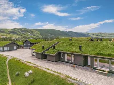 an image of a house with a grass roof at Beautiful City Cottage at Geilotunet in Hol