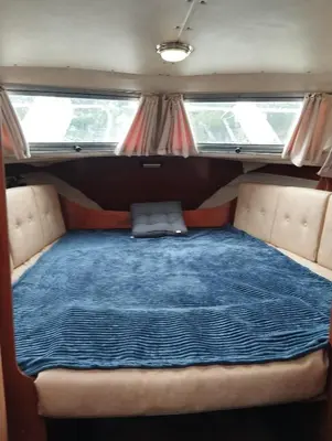 a bed in the back of a camper van at Flamingo in Vikedal
