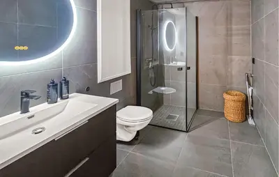 a bathroom with a toilet and a glass shower at Stunning Apartment In Hemsedal in Hemsedal