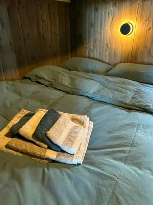 a towel sitting on top of a bed at Modern Cabin By The Ski Trails At Fagerhøy in Sør-Fron