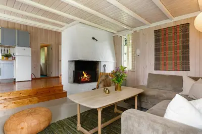 a living room with a couch and a fireplace at Mountain Base For Active Explorers in Oppdal
