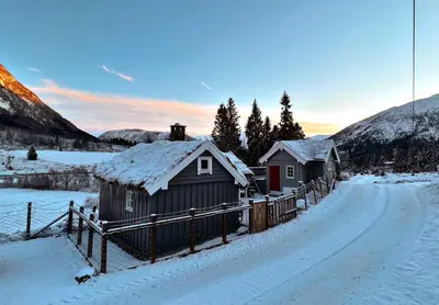 a couple of small buildings in the snow at Cozy chair in Jølster in Skei