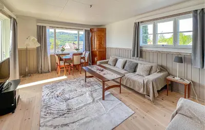 a living room with a couch and a table at Lovely Apartment In Lillehammer in Lillehammer