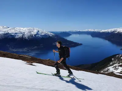a man on skis on top of a mountain at Hardanger Fjord Living in Vossevangen
