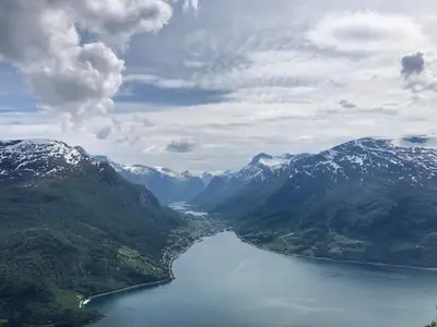 an aerial view of a lake in the mountains at Charming farmhouse with jacuzzi and patio in Stryn