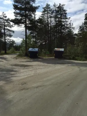 two containers sitting on the side of a dirt road at Holiday cabin, Kristianplass at Bjorli, Lesja in Bjorli