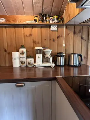 a kitchen counter with a coffee maker on it at Holiday cabin, Kristianplass at Bjorli, Lesja in Bjorli