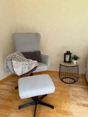 a chair with a blanket on top of it in a room at Stryn Central View in Stryn