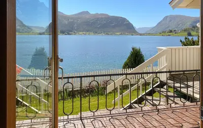 a view of a lake from a balcony at Stunning Apartment In Selje With Wifi in Selje
