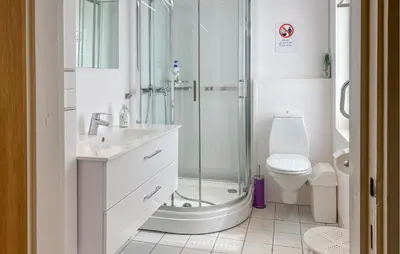 a bathroom with a shower and a sink and a toilet at Stunning Apartment In Selje With Wifi in Selje