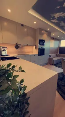 a kitchen with a white counter top in a room at Penthouse apartment with sauna, balcony and free coffe in Bergen