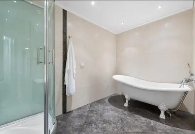 a bathroom with a bath tub and a shower at Bønes in Bergen